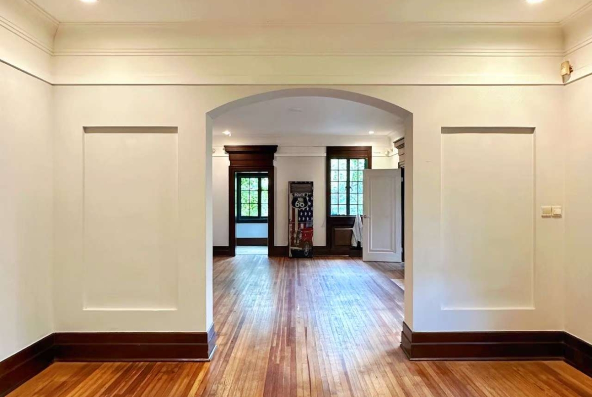 1928 heritage garden villa on protected Hunan Road. Main building first floor plus separate annex. 150 sqm private garden, garage included. 58,000 RMB/month.