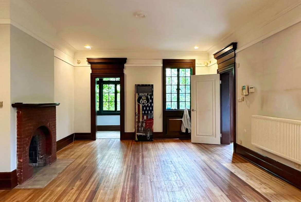 1928 heritage garden villa on protected Hunan Road. Main building first floor plus separate annex. 150 sqm private garden, garage included. 58,000 RMB/month.