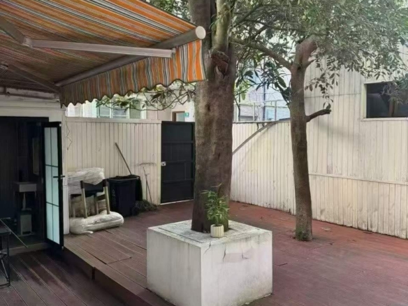 Ground floor lane house with private garden near Jing'an Temple. 80 sqm interior, 50 sqm garden. Live or work. 18,000 RMB/month.