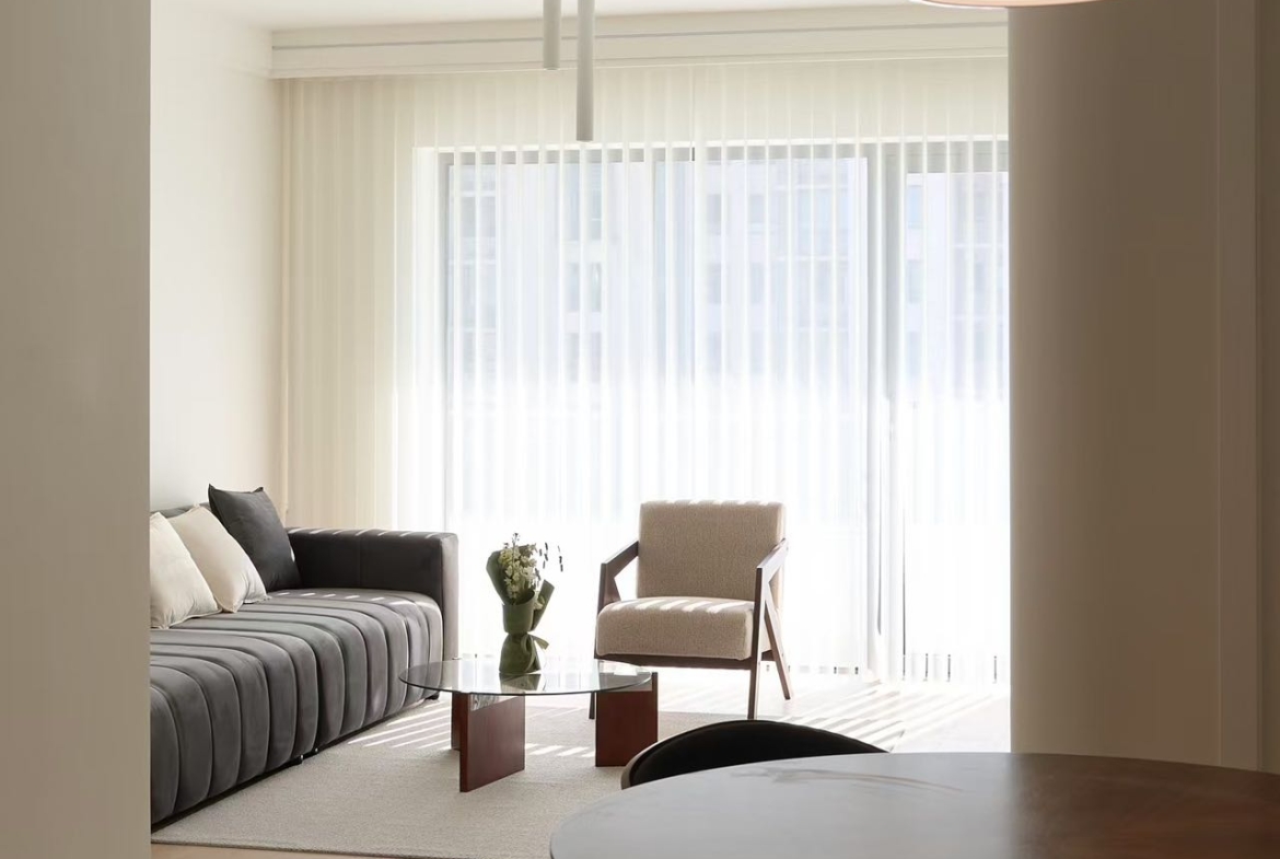 High floor 2-bed unit at Eight Park Avenue in Jing'an. 116 sqm, full underfloor heating + central AC. Close to Changping Road Station. 29,800 RMB/month.