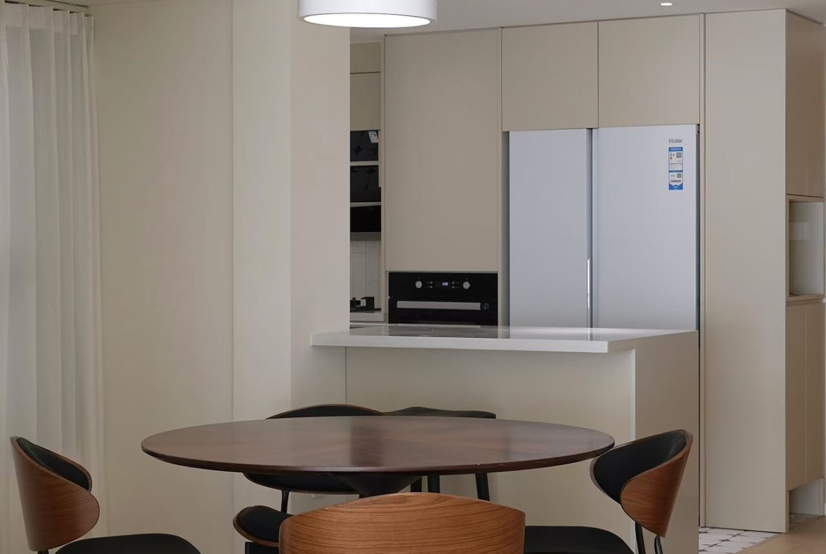 High floor 2-bed unit at Eight Park Avenue in Jing'an. 116 sqm, full underfloor heating + central AC. Close to Changping Road Station. 29,800 RMB/month.