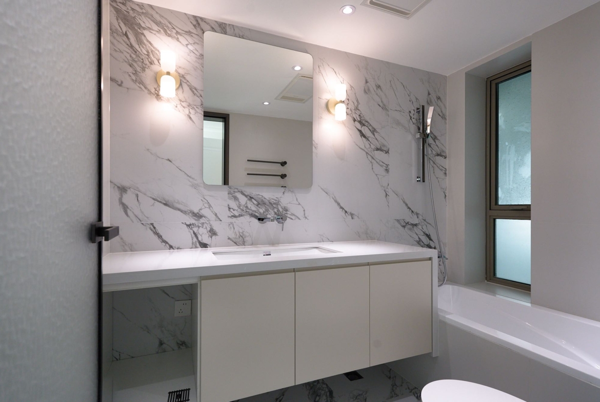 High floor 2-bed unit at Eight Park Avenue in Jing'an. 116 sqm, full underfloor heating + central AC. Close to Changping Road Station. 29,800 RMB/month.