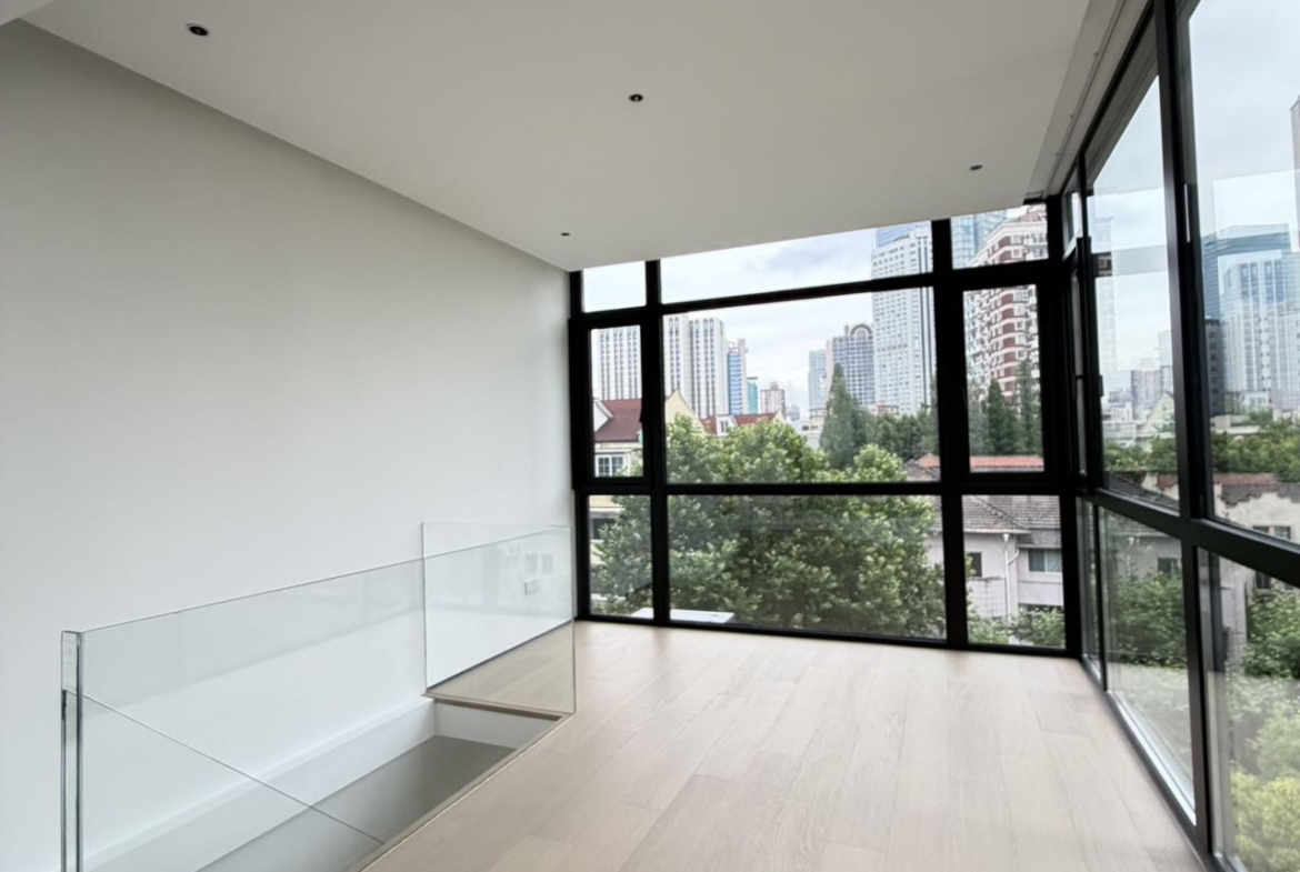Top floor penthouse at The Summit in the Former French Concession. 5+1 bedrooms, 4 bathrooms, large private terrace. Steps from Anfu Road. 100,000 RMB/month.