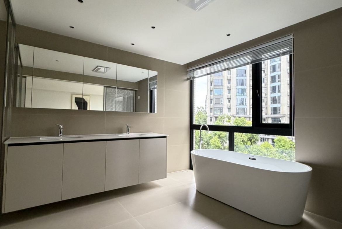 Top floor penthouse at The Summit in the Former French Concession. 5+1 bedrooms, 4 bathrooms, large private terrace. Steps from Anfu Road. 100,000 RMB/month.