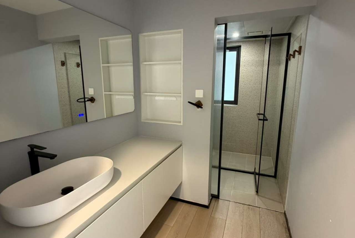 3-bed, 2-bath unit at Xingguo Mansion on Wukang Road / Huaihai Road. 150 sqm, third bedroom can be office, oven, wall heating. 26,000 RMB/month negotiable.