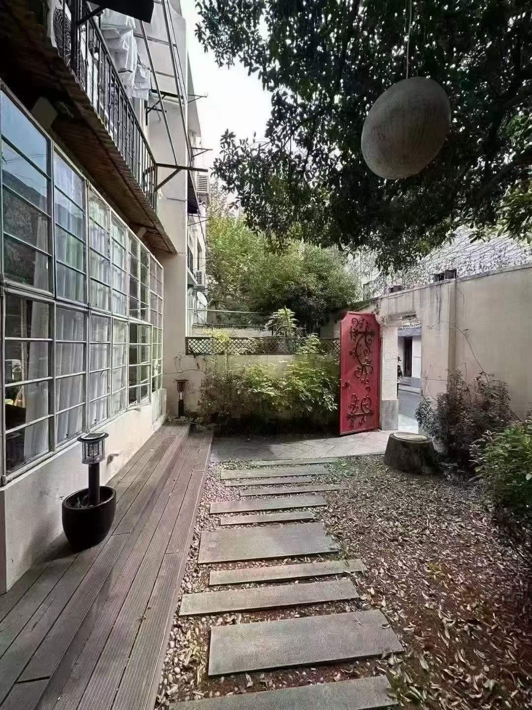 Ground floor creative studio on Gao'an Road with 80 sqm courtyard. 110 sqm double-bay space, mezzanine room, set back from main road. 29,000 RMB/month