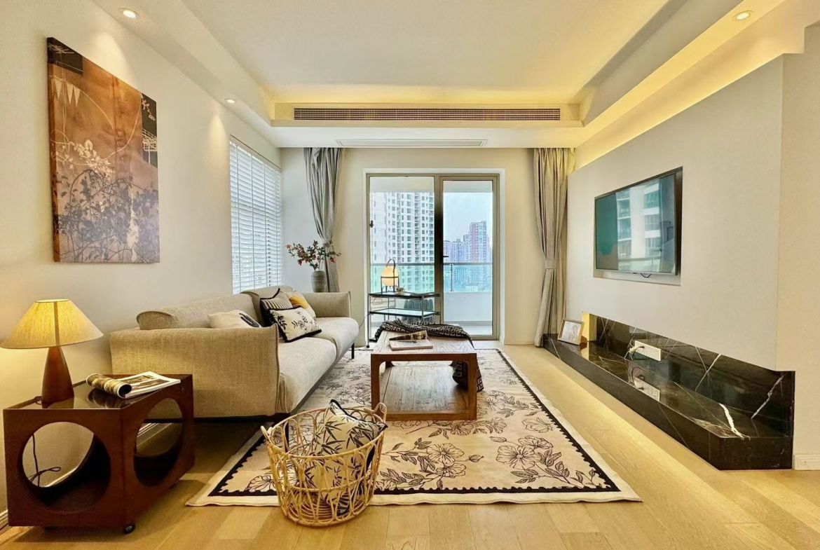 2-bed, 2-bath unit at One Park Avenue in Jing'an. 18th floor, 120 sqm, central AC, underfloor heating. Close to Jing'an Temple Station. 28,600 RMB/month.