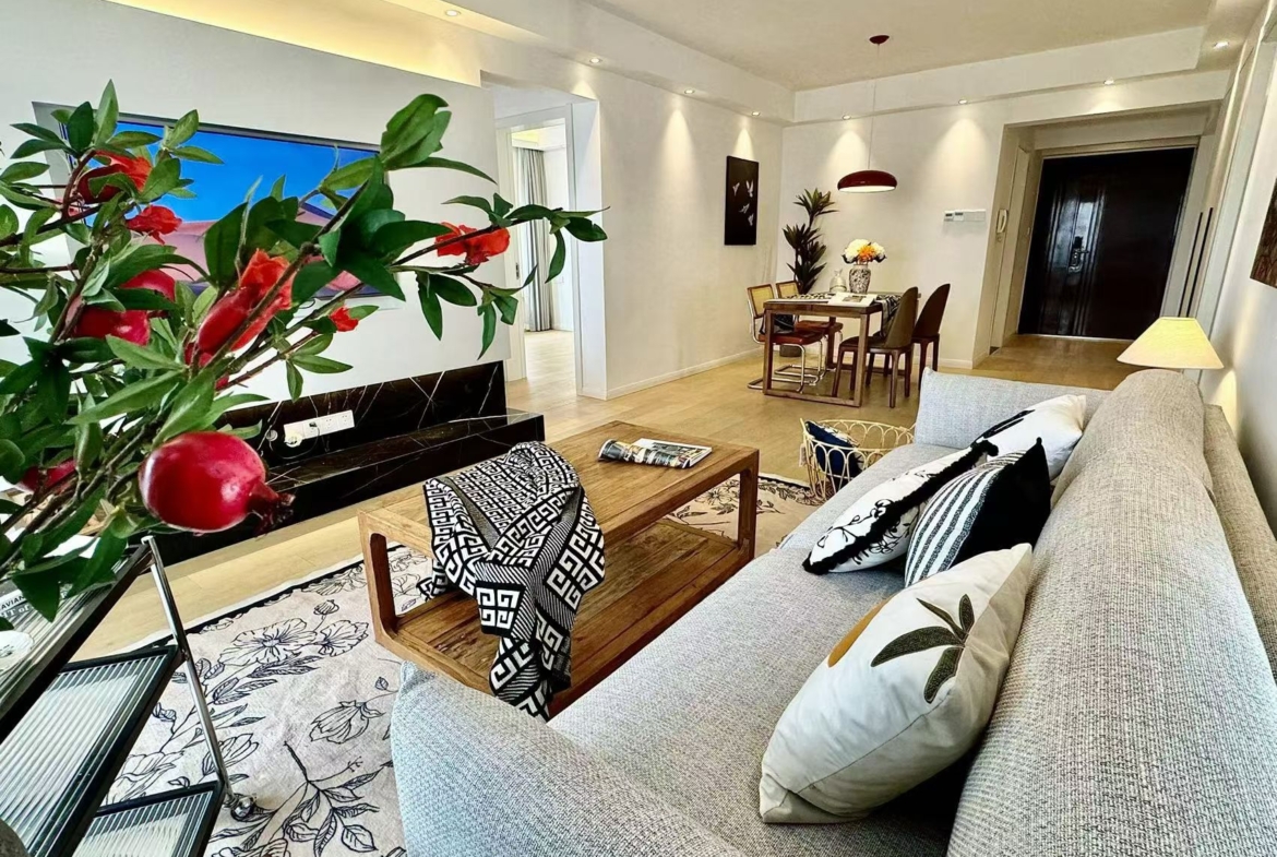 2-bed, 2-bath unit at One Park Avenue in Jing'an. 18th floor, 120 sqm, central AC, underfloor heating. Close to Jing'an Temple Station. 28,600 RMB/month.