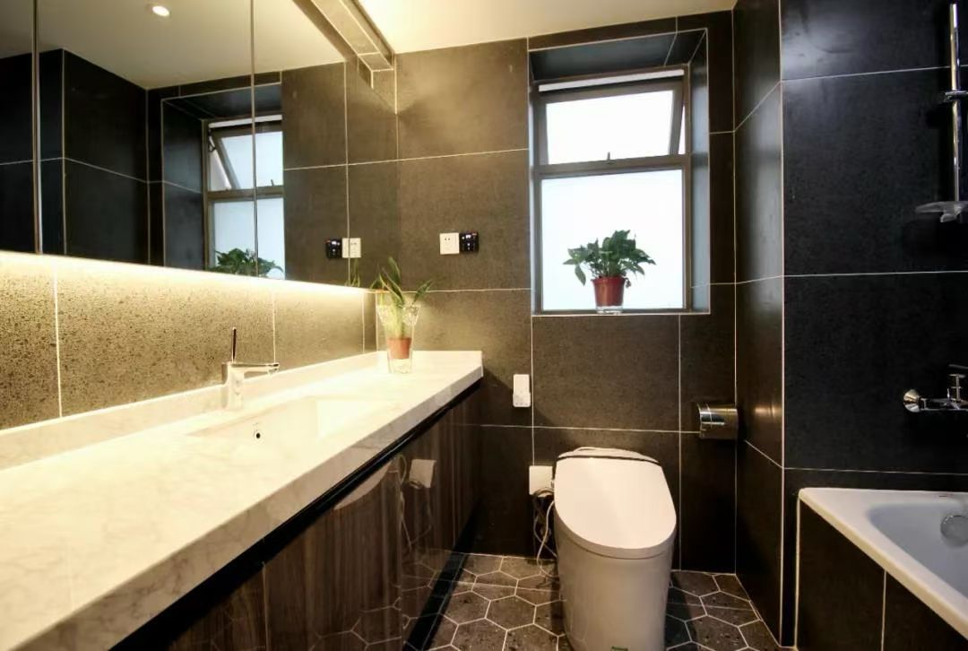 2-bed, 2-bath unit at One Park Avenue in Jing'an. 18th floor, 120 sqm, central AC, underfloor heating. Close to Jing'an Temple Station. 28,600 RMB/month.