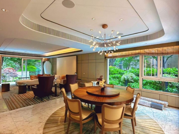 Ground floor duplex at The Paragon on Maoming South Road. 406 sqm, 4 beds, 5 baths, 80 sqm private garden, underfloor heating, clubhouse. 138,000 RMB/month.