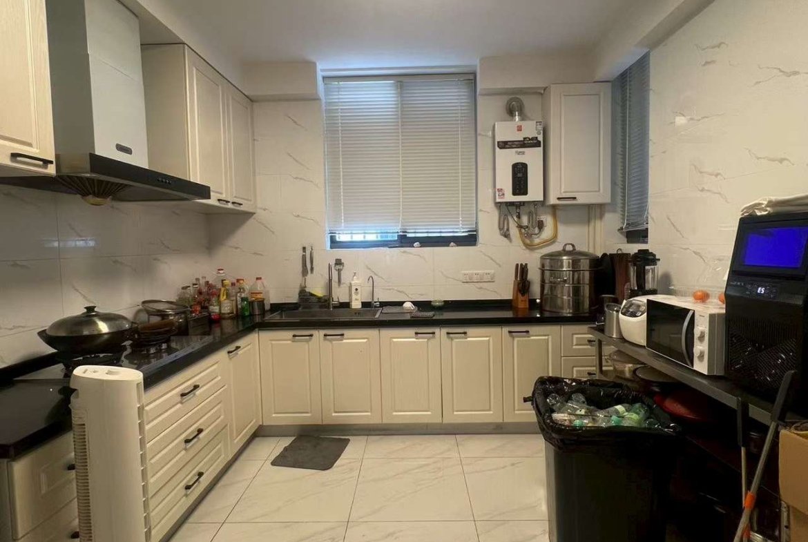 Ground floor lane house on North Urumqi Road with private garden. 100 sqm, 1 bed, 1 bath, 30 sqm garden. Live or work. 22,000 RMB/month.