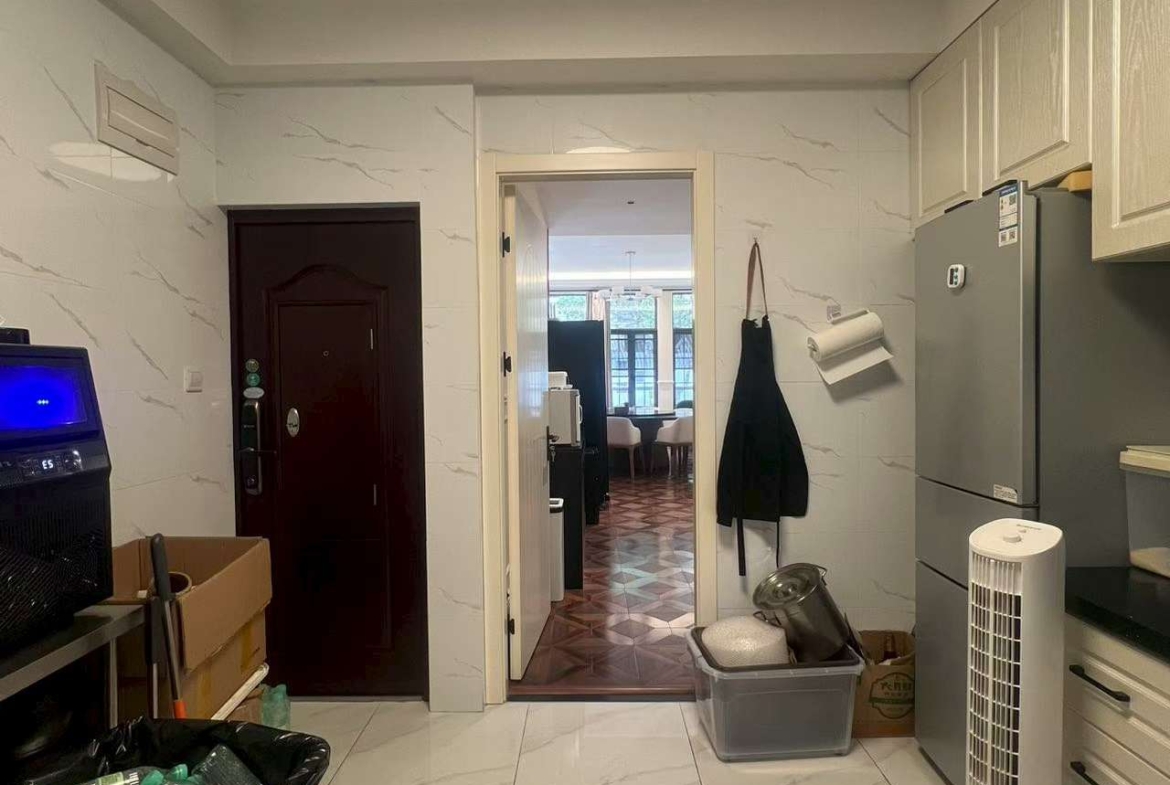 Ground floor lane house on North Urumqi Road with private garden. 100 sqm, 1 bed, 1 bath, 30 sqm garden. Live or work. 22,000 RMB/month.