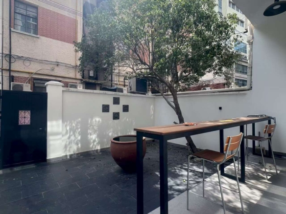 Ground floor lane house on North Urumqi Road with private garden. 100 sqm, 1 bed, 1 bath, 30 sqm garden. Live or work. 22,000 RMB/month.
