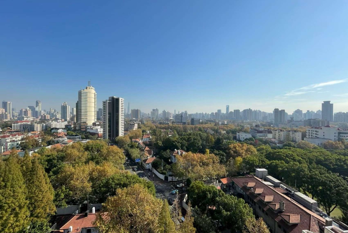 2-bed, 2-bath unit at Ambassy Court on Huaihai Road. 123 sqm, southeast facing, large balcony, underfloor heating, clubhouse with pools and gym. 25,000 RMB/month.