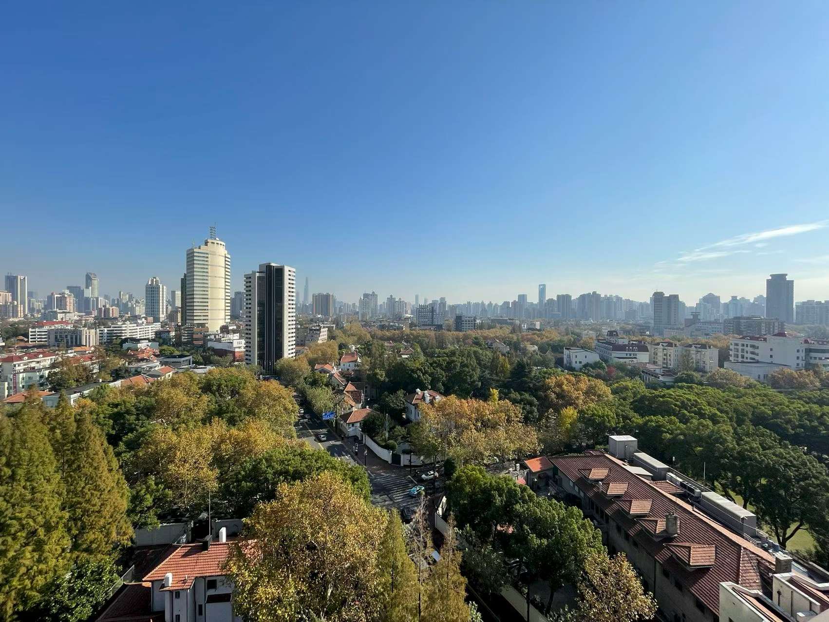 2-bed, 2-bath unit at Ambassy Court on Huaihai Road. 123 sqm, southeast facing, large balcony, underfloor heating, clubhouse with pools and gym. 25,000 RMB/month.