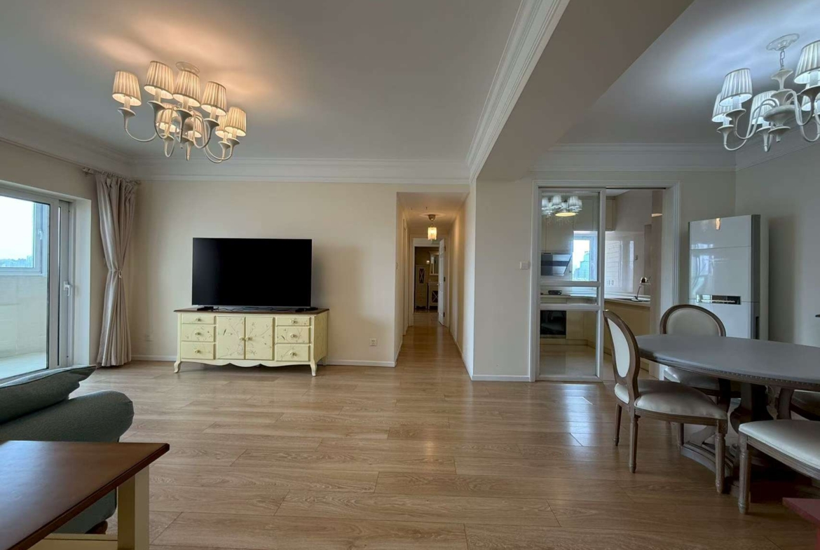 2-bed, 2-bath unit at Ambassy Court on Huaihai Road. 123 sqm, southeast facing, large balcony, underfloor heating, clubhouse with pools and gym. 25,000 RMB/month.