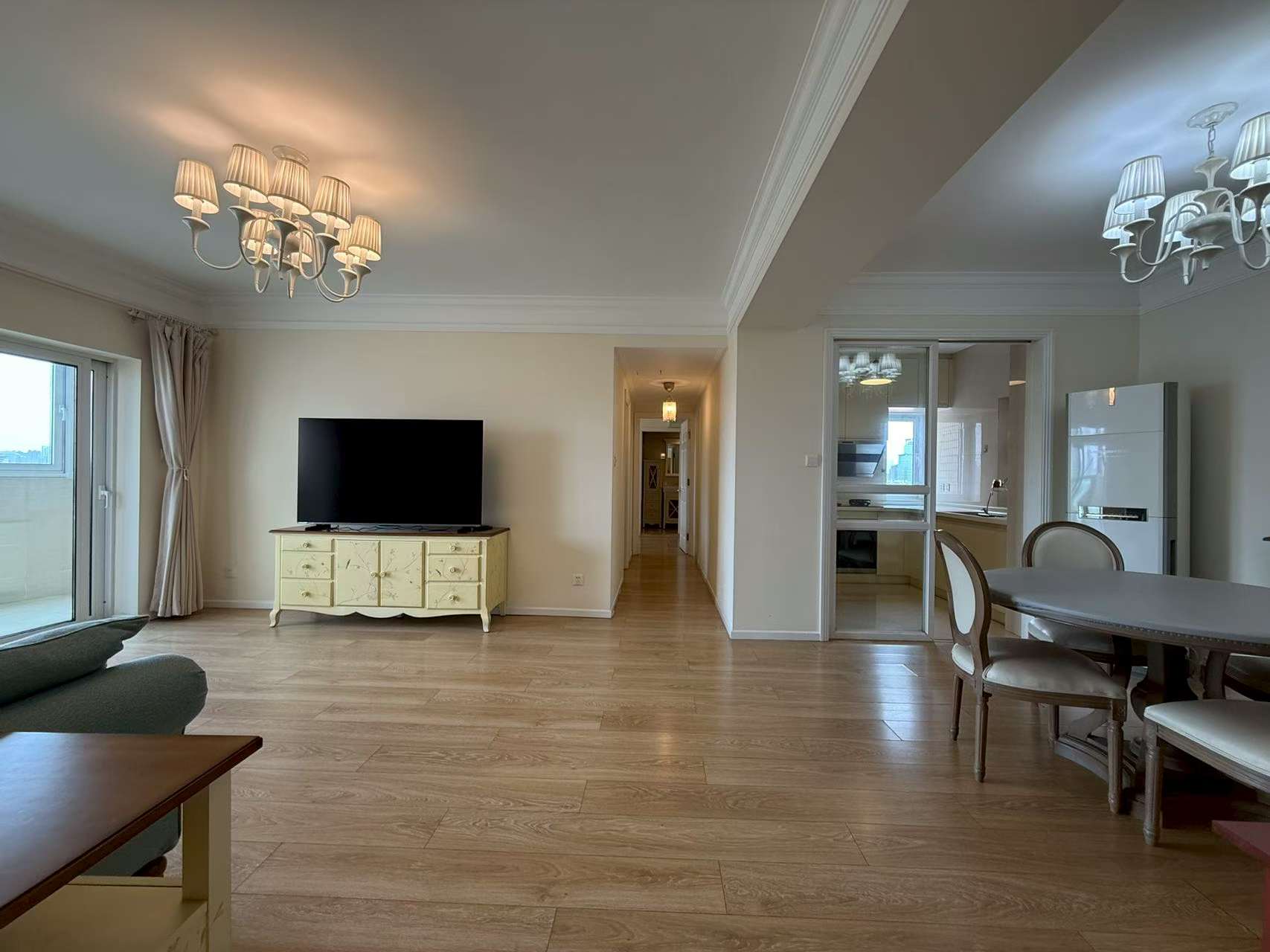 2-bed, 2-bath unit at Ambassy Court on Huaihai Road. 123 sqm, southeast facing, large balcony, underfloor heating, clubhouse with pools and gym. 25,000 RMB/month.