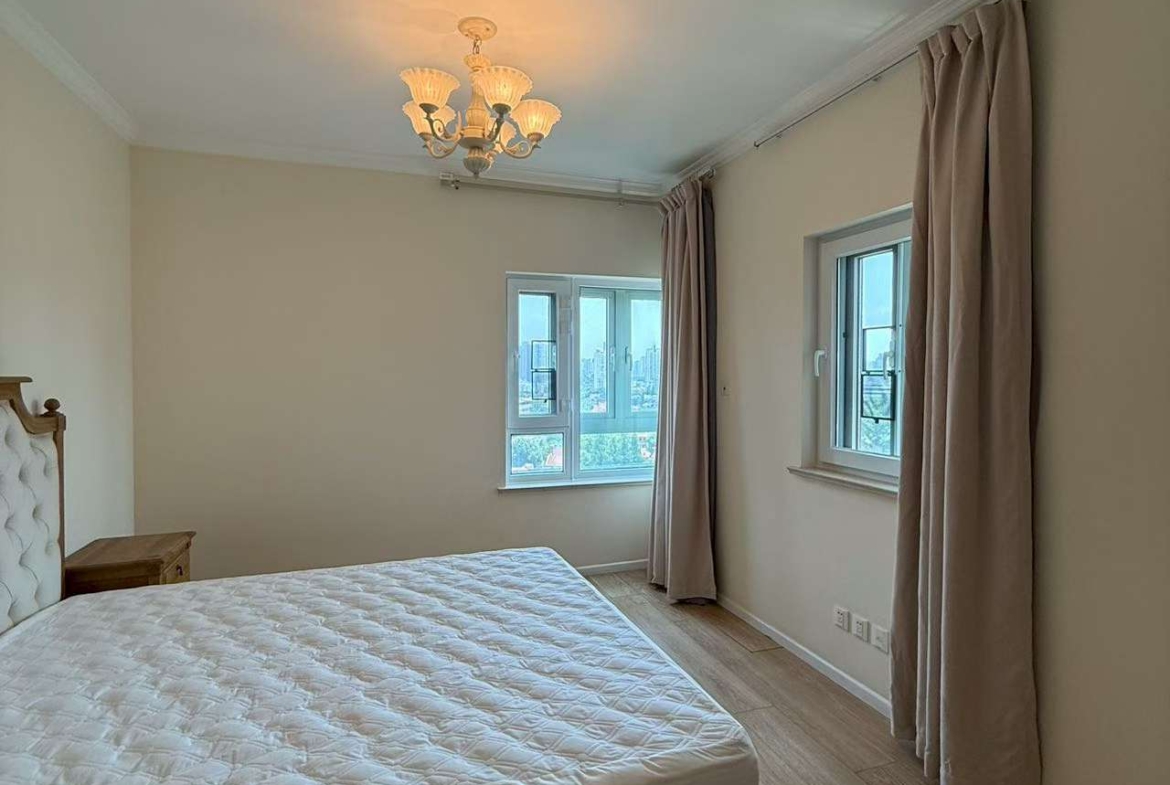 2-bed, 2-bath unit at Ambassy Court on Huaihai Road. 123 sqm, southeast facing, large balcony, underfloor heating, clubhouse with pools and gym. 25,000 RMB/month.