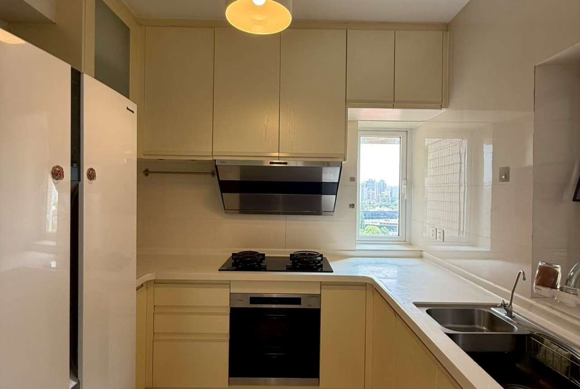 2-bed, 2-bath unit at Ambassy Court on Huaihai Road. 123 sqm, southeast facing, large balcony, underfloor heating, clubhouse with pools and gym. 25,000 RMB/month.