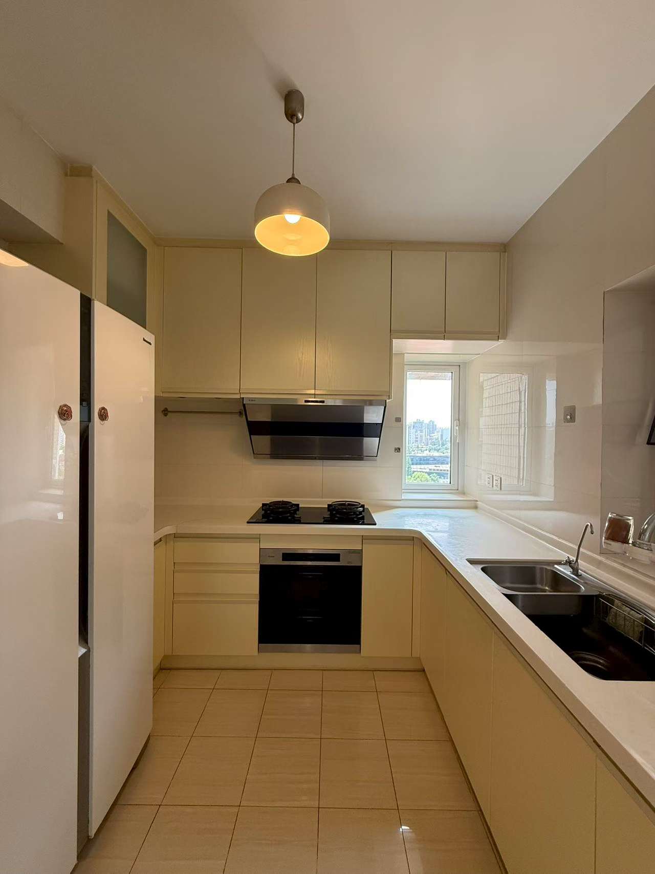 2-bed, 2-bath unit at Ambassy Court on Huaihai Road. 123 sqm, southeast facing, large balcony, underfloor heating, clubhouse with pools and gym. 25,000 RMB/month.
