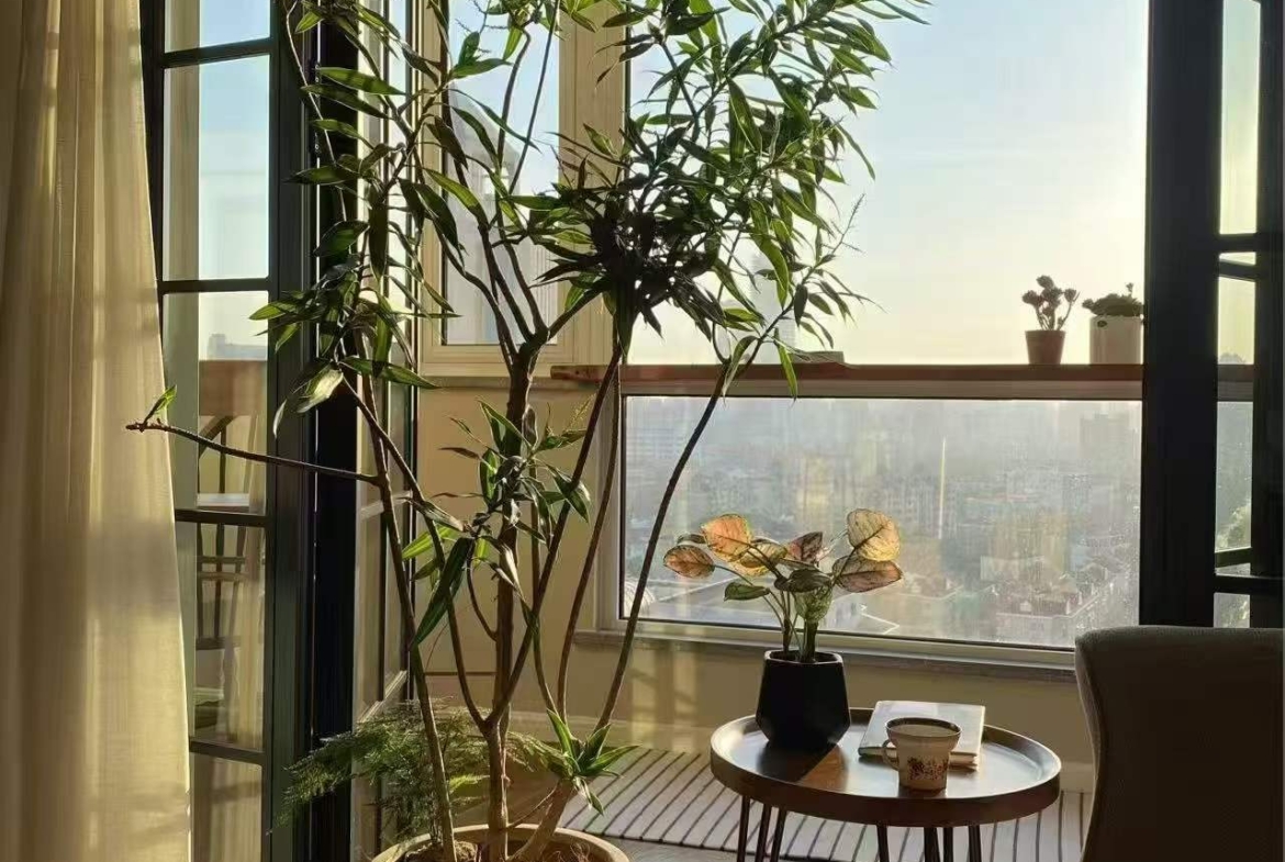 High-floor 2-bed, 2-bath unit at Ambassy Court on Huaihai Road. 114 sqm, Italian designer renovation, imported finishes, underfloor heating, clubhouse. 28,000 RMB/month.