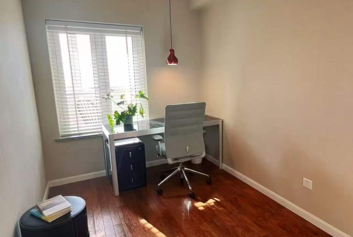 High-floor 2-bed, 2-bath unit at Ambassy Court on Huaihai Road. 114 sqm, Italian designer renovation, imported finishes, underfloor heating, clubhouse. 28,000 RMB/month.