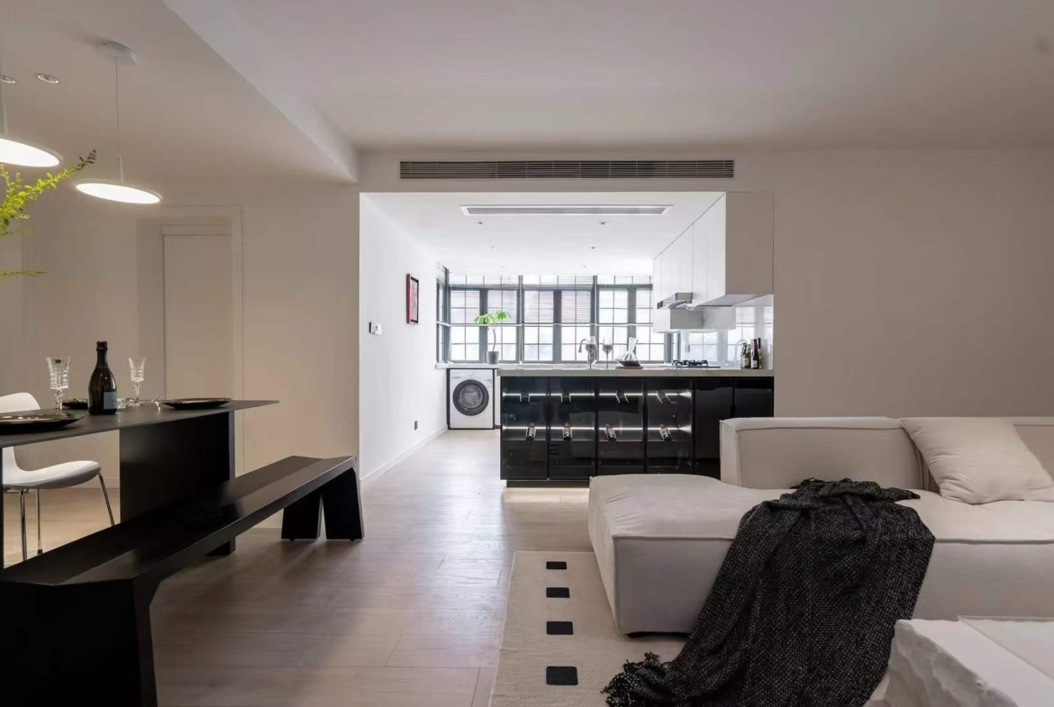 Quiet 40-unit compound on Jianguo West Road. 3-bed unit with underfloor heating, central AC, private balcony, and parking included. Near Zhaojiabang Road Station. 26,800 RMB/month.