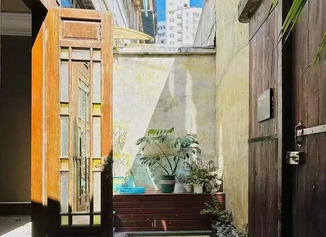 Entire protected lane house on Julu Road. 4 beds, 3 baths, 210 sqm, courtyard, terrace, wall heating. Live or work in the heart of Ju Fu Chang. 26,800 RMB/month.