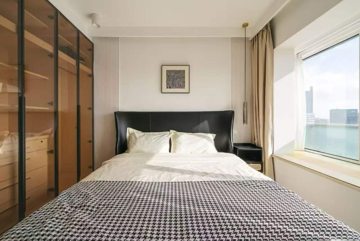 2-bed, 2-bath high-floor unit at One Park Avenue in Jing'an. 32nd floor, central location near Jing'an Temple. Special price. 23,000 RMB/month.