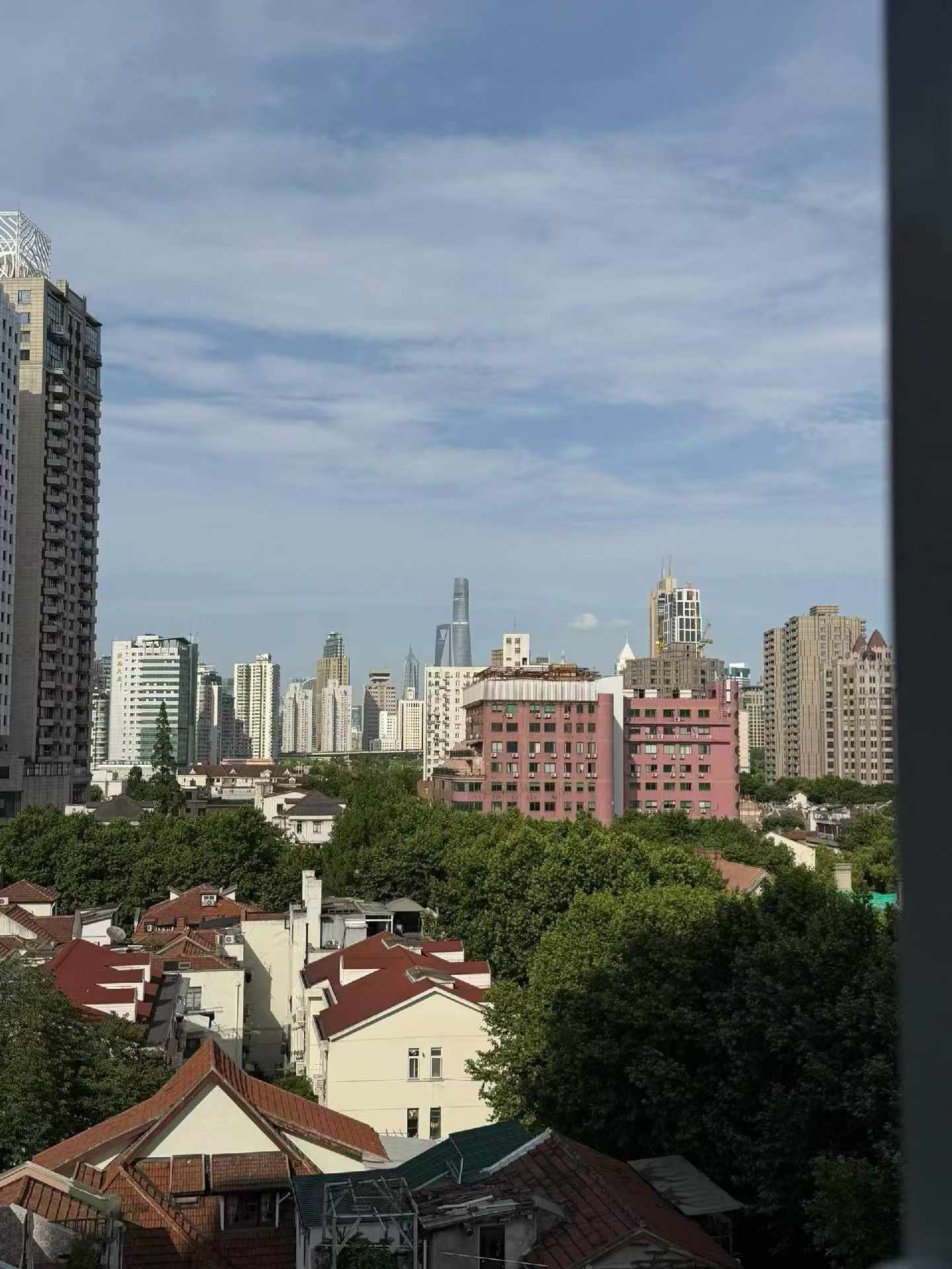 High floor 2-bed unit at Shanghai Grand Plaza on Julu Road. Southeast facing, Lujiazui skyline view, pool view, long-term lease available. 22,000 RMB/month.