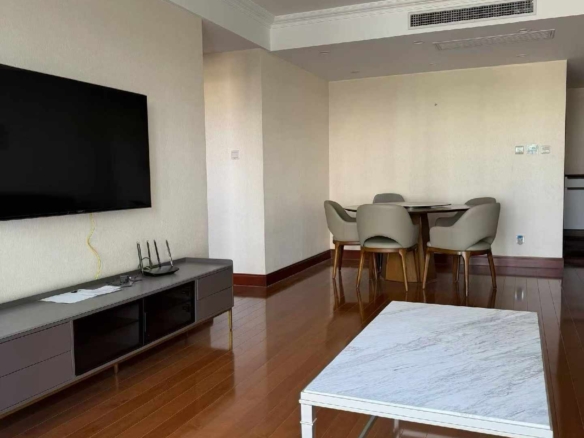 High floor 2-bed unit at Shanghai Grand Plaza on Julu Road. Southeast facing, Lujiazui skyline view, pool view, long-term lease available. 22,000 RMB/month.