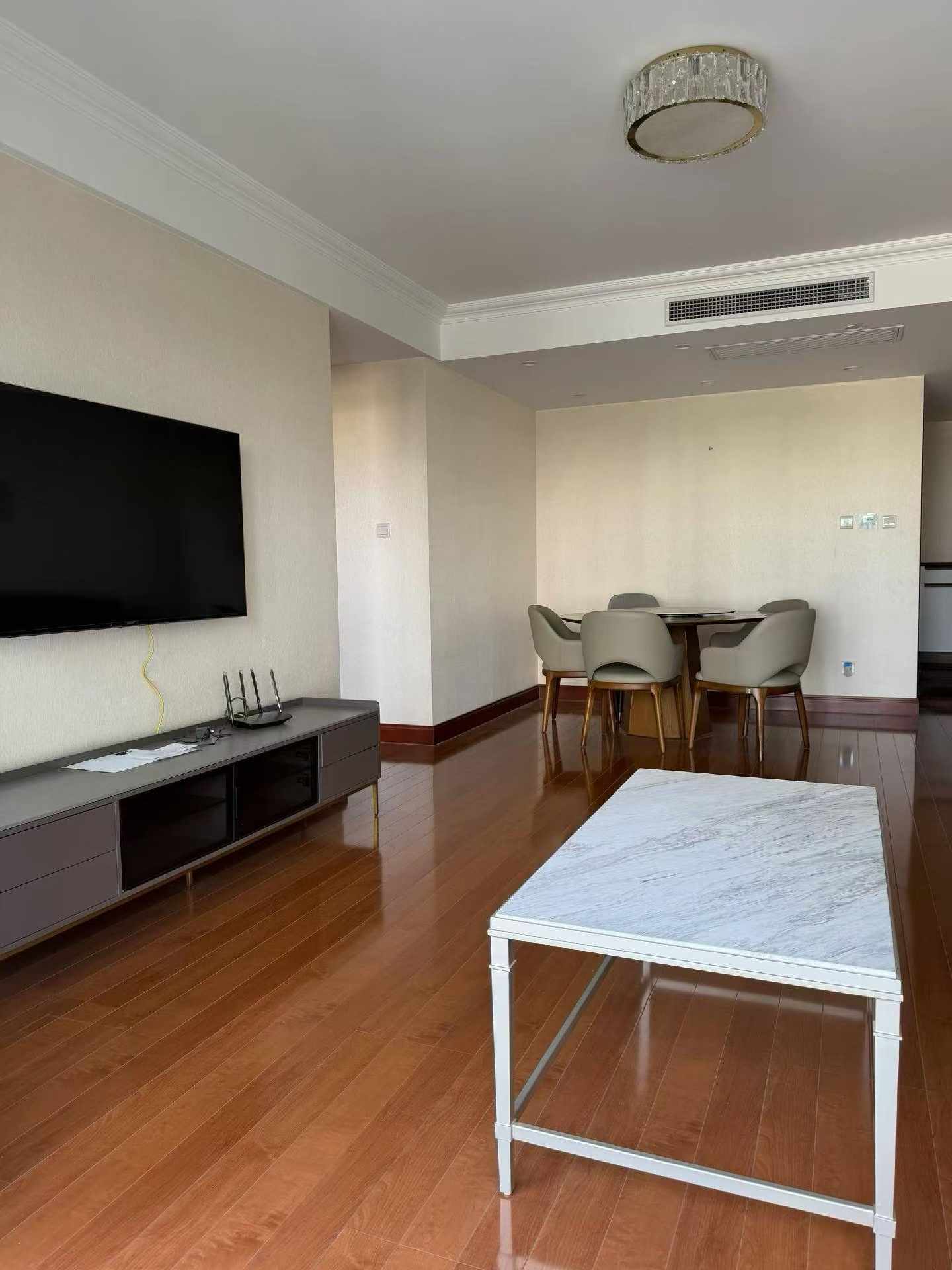 High floor 2-bed unit at Shanghai Grand Plaza on Julu Road. Southeast facing, Lujiazui skyline view, pool view, long-term lease available. 22,000 RMB/month.