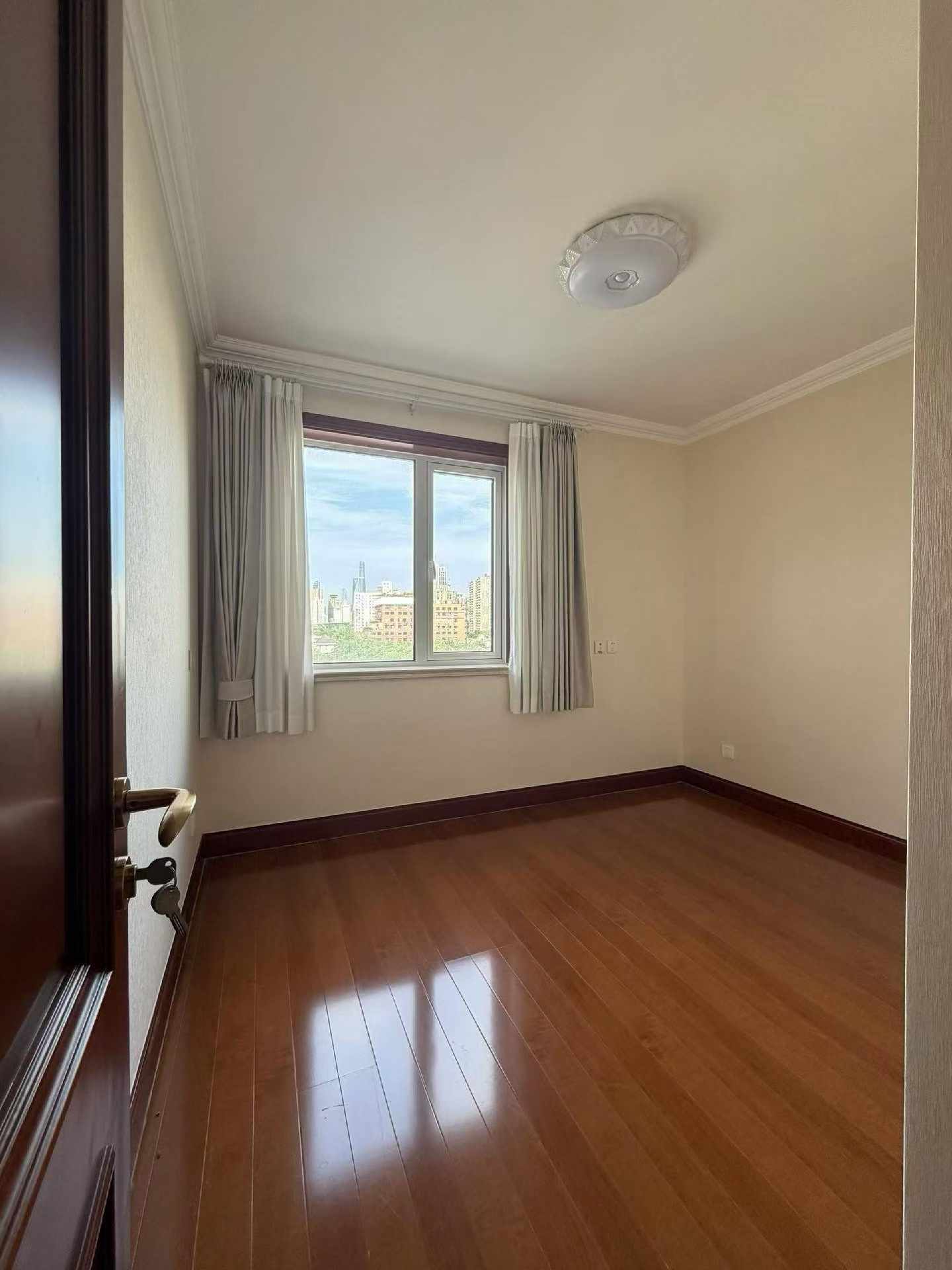High floor 2-bed unit at Shanghai Grand Plaza on Julu Road. Southeast facing, Lujiazui skyline view, pool view, long-term lease available. 22,000 RMB/month.