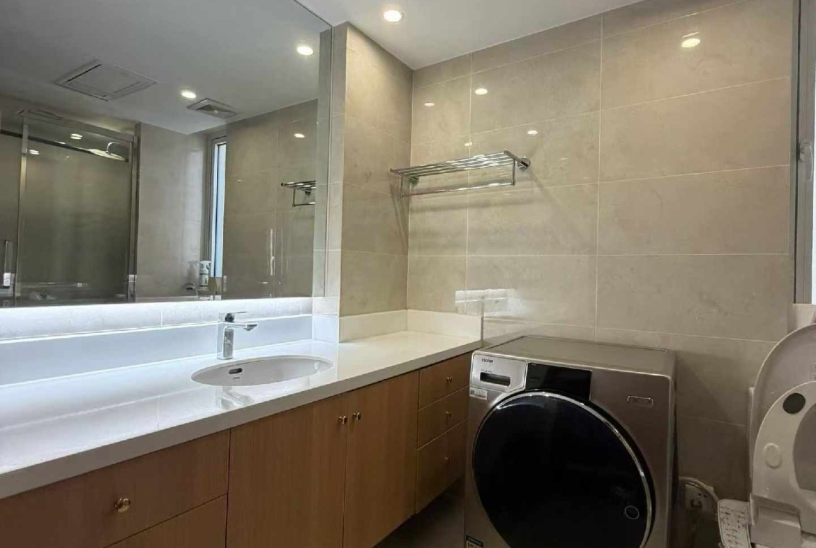 High floor 2-bed unit at Shanghai Grand Plaza on Julu Road. Southeast facing, Lujiazui skyline view, pool view, long-term lease available. 22,000 RMB/month.