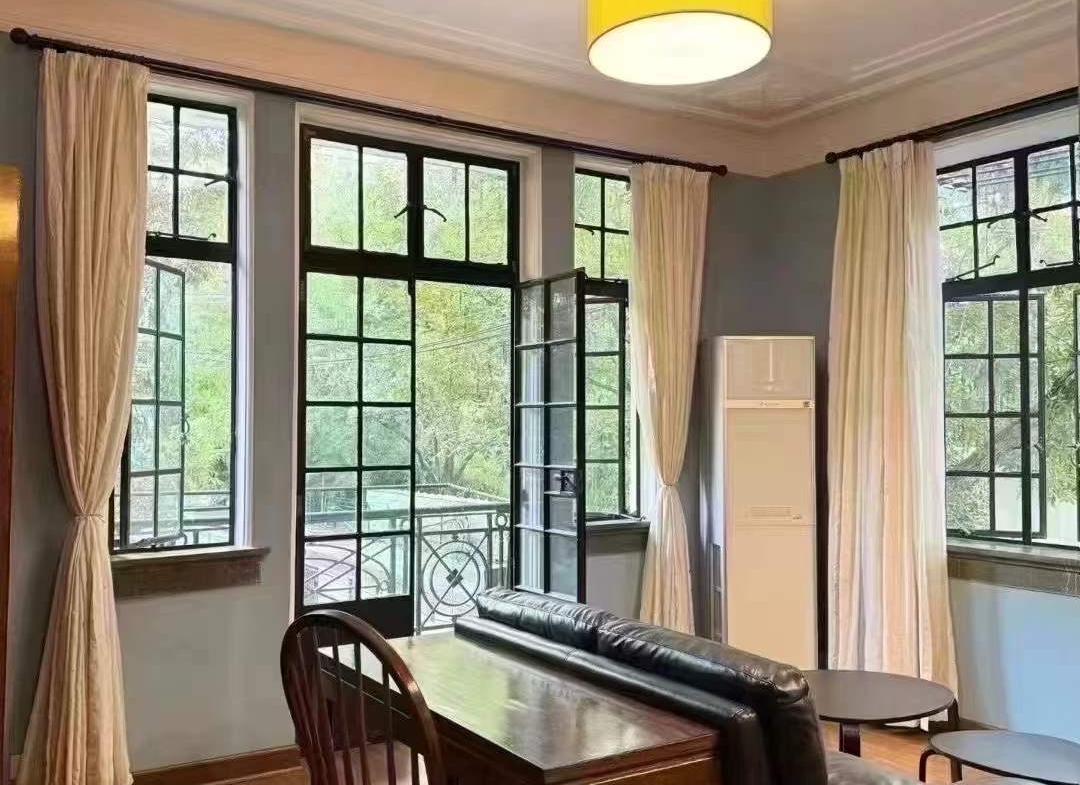Heritage apartment in the historic Garden Apartment on Nanjing West Road. 80 sqm, 1-bed, 2-living, private balcony, steps from West Nanjing Road Station. 17,800 RMB/month.