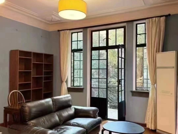 Heritage apartment in the historic Garden Apartment on Nanjing West Road. 80 sqm, 1-bed, 2-living, private balcony, steps from West Nanjing Road Station. 17,800 RMB/month.