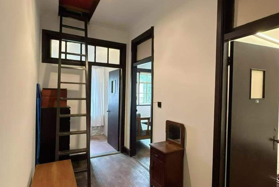 3rd floor unit on Anfu Road near Wukang Road. 2 beds, 2 living rooms, 1 bath, north-south through, private balcony. Prime FFC location. 17,000 RMB/month.