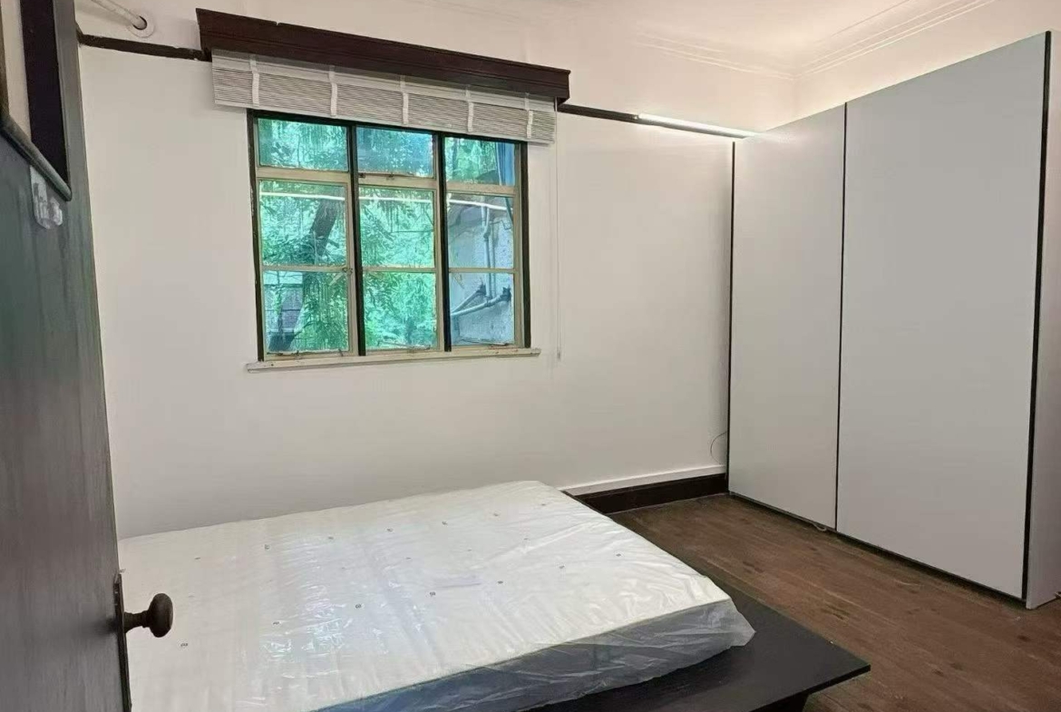 3rd floor unit on Anfu Road near Wukang Road. 2 beds, 2 living rooms, 1 bath, north-south through, private balcony. Prime FFC location. 17,000 RMB/month.