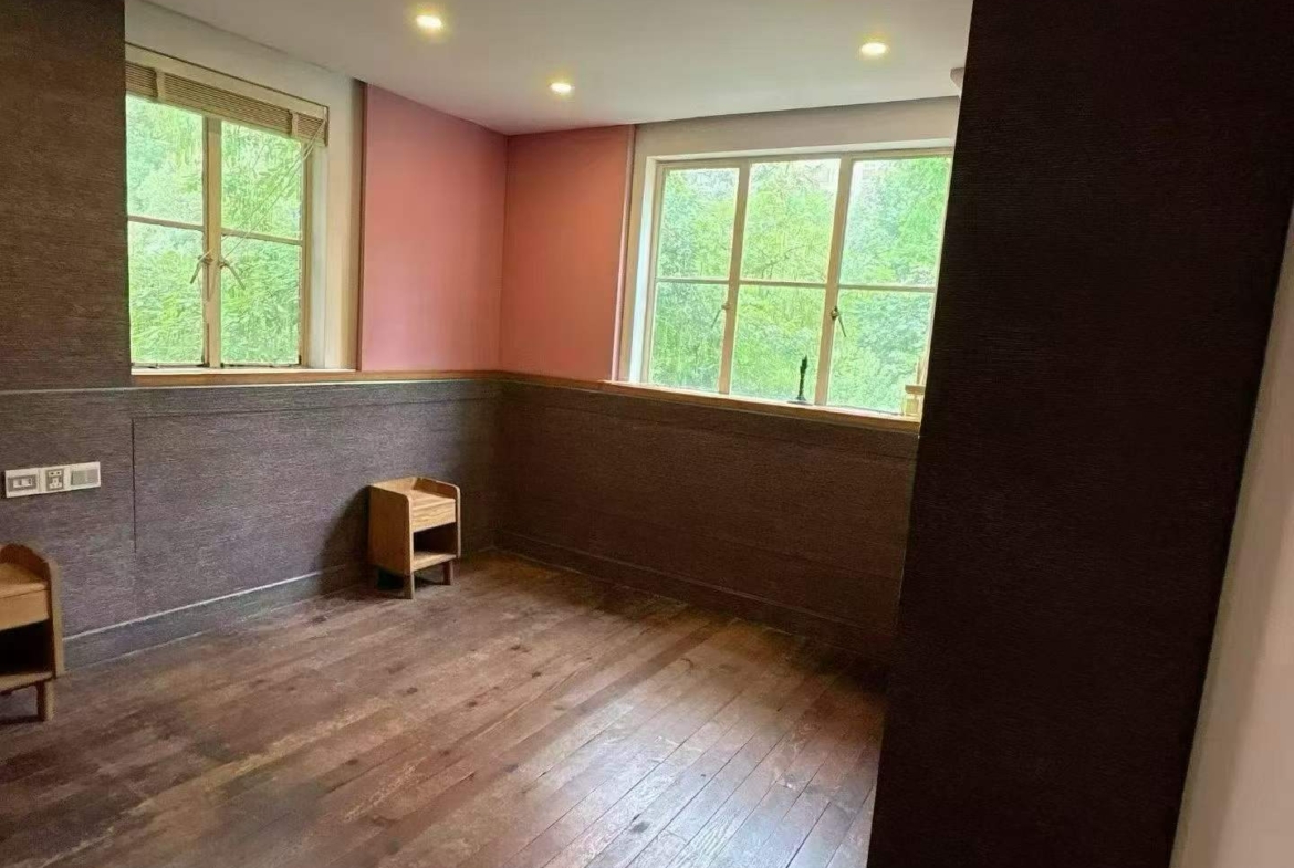 3rd floor unit on Anfu Road near Wukang Road. 2 beds, 2 living rooms, 1 bath, north-south through, private balcony. Prime FFC location. 17,000 RMB/month.