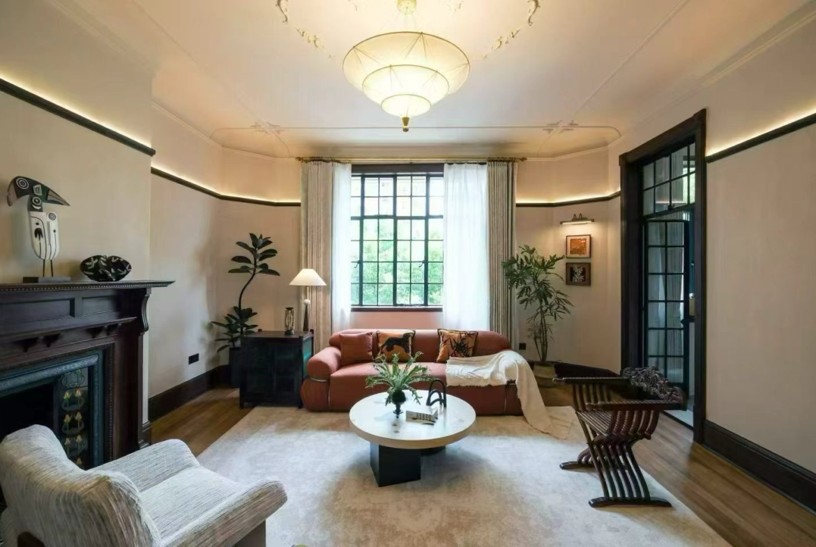 2-bed, 2-bath heritage unit at Pass Apartment on Changshu Road. 150 sqm, 80 sqm terrace, original fireplace, first rental. Steps from metro. 42,800 RMB/month.