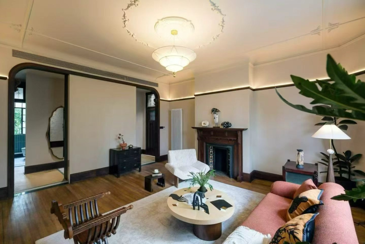 2-bed, 2-bath heritage unit at Pass Apartment on Changshu Road. 150 sqm, 80 sqm terrace, original fireplace, first rental. Steps from metro. 42,800 RMB/month.