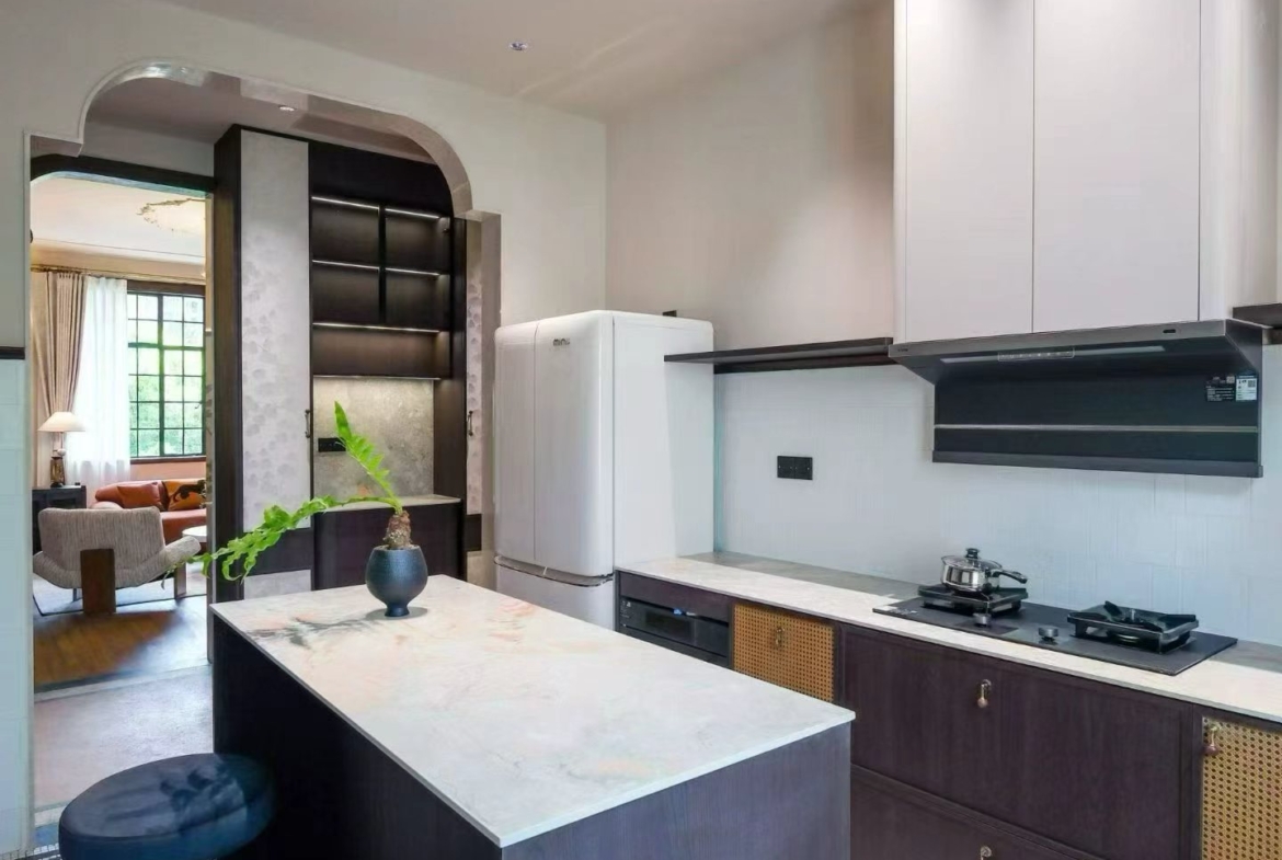 2-bed, 2-bath heritage unit at Pass Apartment on Changshu Road. 150 sqm, 80 sqm terrace, original fireplace, first rental. Steps from metro. 42,800 RMB/month.