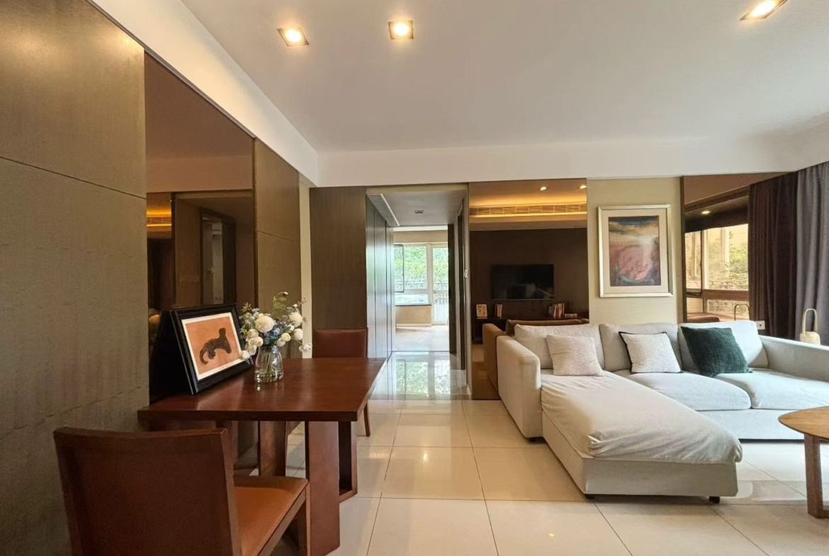 1-bed, 2-living, 1-bath unit at City Castle in Jing'an. 75 sqm, central AC, balcony, clubhouse access. Near Nanjing West Road. 16,600 RMB/month.