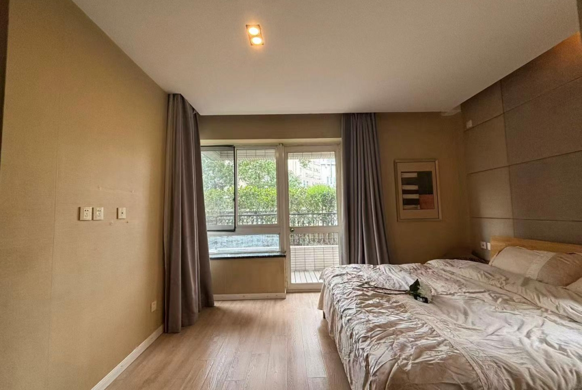 1-bed, 2-living, 1-bath unit at City Castle in Jing'an. 75 sqm, central AC, balcony, clubhouse access. Near Nanjing West Road. 16,600 RMB/month.