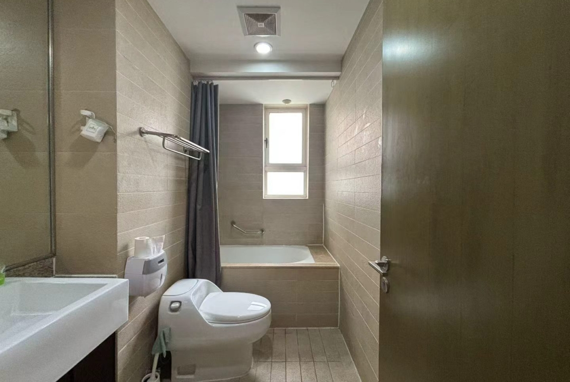 1-bed, 2-living, 1-bath unit at City Castle in Jing'an. 75 sqm, central AC, balcony, clubhouse access. Near Nanjing West Road. 16,600 RMB/month.
