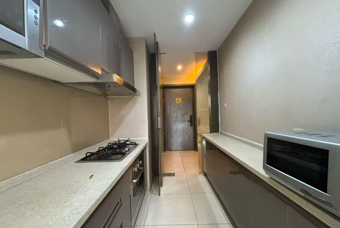 1-bed, 2-living, 1-bath unit at City Castle in Jing'an. 75 sqm, central AC, balcony, clubhouse access. Near Nanjing West Road. 16,600 RMB/month.