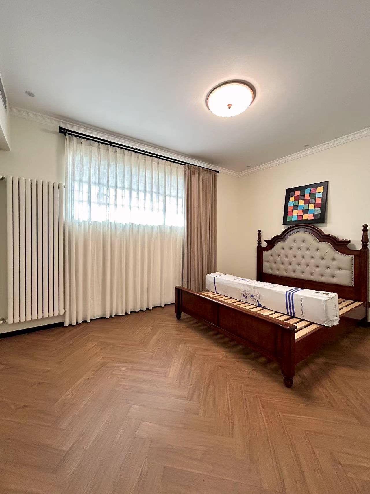 4th floor heritage apartment on Huaihai Road. 2 beds, 2 baths, 3.3m ceilings, central AC, wall heating, smart toilet. Steps from Changshu Road Station. 33,800 RMB/month.