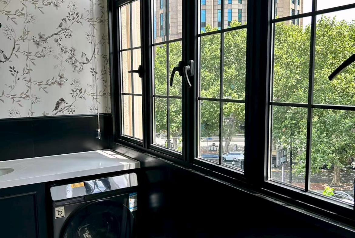 4th floor heritage apartment on Huaihai Road. 2 beds, 2 baths, 3.3m ceilings, central AC, wall heating, smart toilet. Steps from Changshu Road Station. 33,800 RMB/month.
