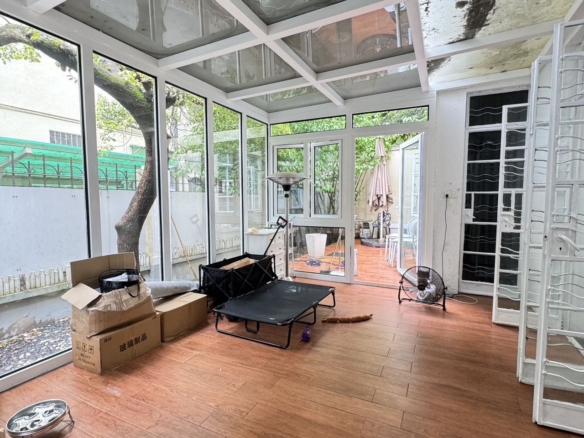 Ground floor studio at Shangfang Garden on Huaihai Road. 70 sqm, 20 sqm garden, 3 flexible rooms, steps from Changshu Road Station. 21,600 RMB/month.