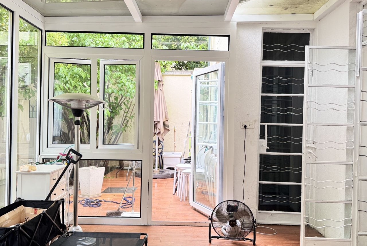 Ground floor studio at Shangfang Garden on Huaihai Road. 70 sqm, 20 sqm garden, 3 flexible rooms, steps from Changshu Road Station. 21,600 RMB/month.